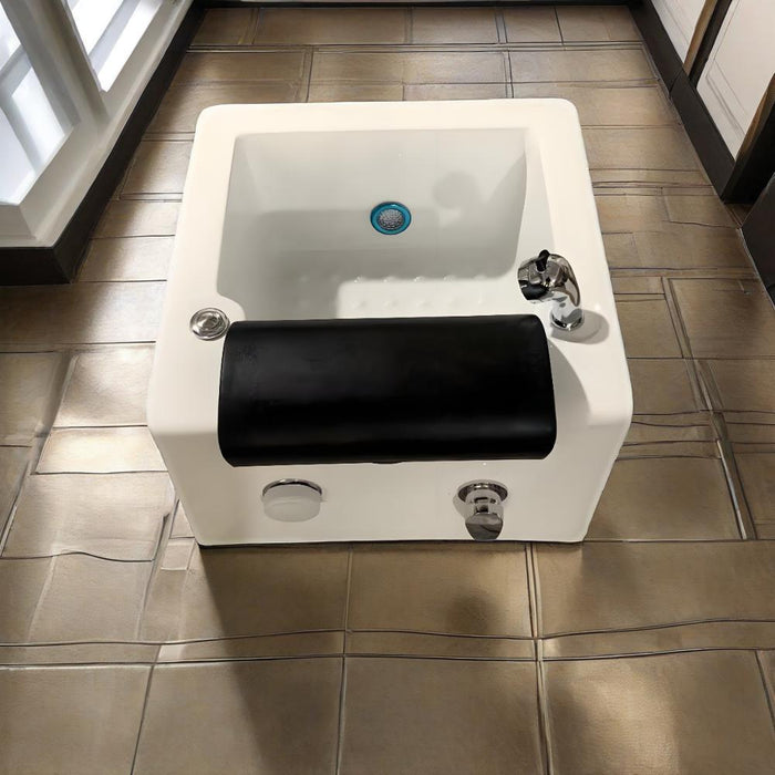 White sink with black basin on a tiled floor