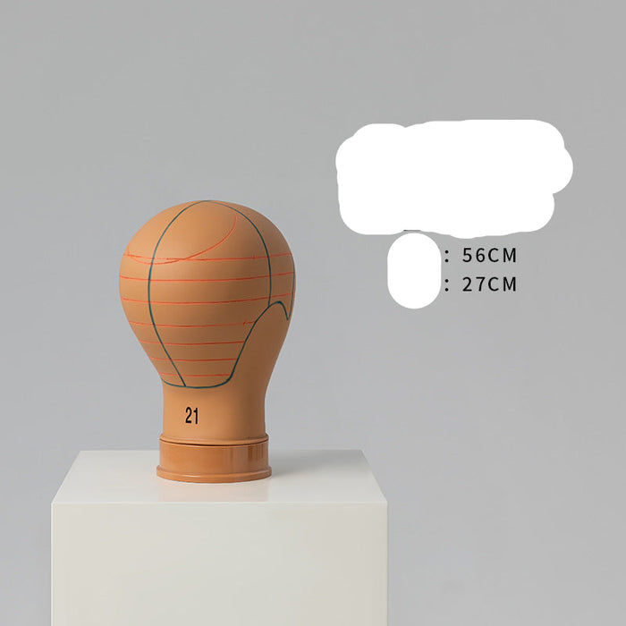 Basketball-shaped mannequin head on a gray background with text indicating dimensions.