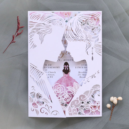 Decorative wedding invitation with floral and lace design on a gray background