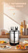 A stainless steel rotisserie grill with black handles and legs sits on a wooden table in a warm kitchen setting, surrounded by plates of food. The scene has promotional text at the top reading 'FAMILY GATHERINGS FUN AND FOOD!'.