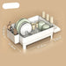 Dish drying rack with measurements on a beige background