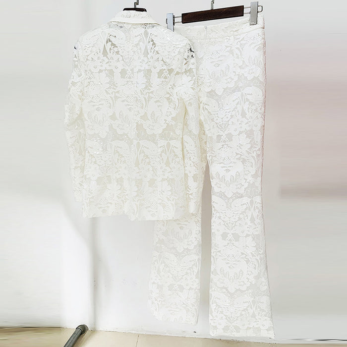 White lace pants on a hanger against a white background