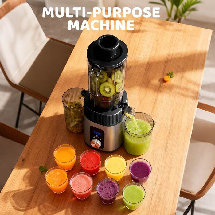 Blender with fruits on a wooden table, surrounded by variously colored juices in glasses.