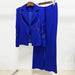 Blue suit with jacket and pants on a hanger against a white background