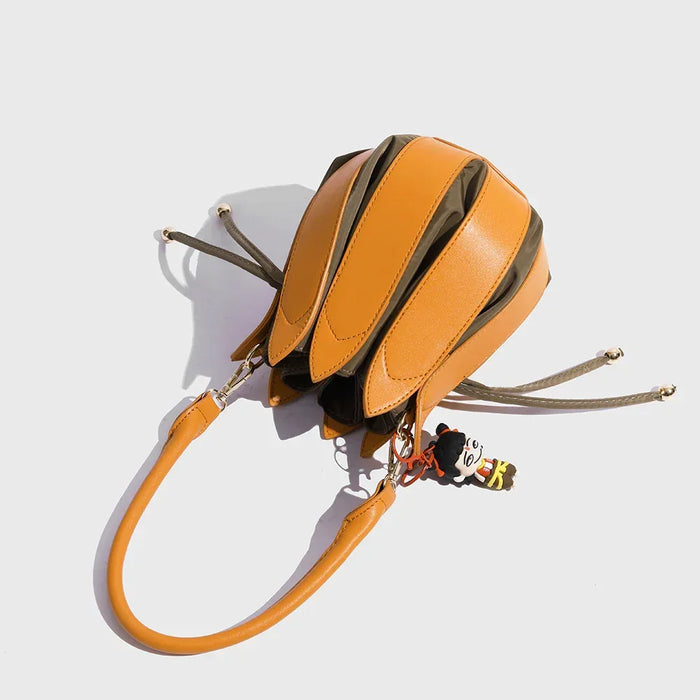 Orange handbag with a unique design on a white background