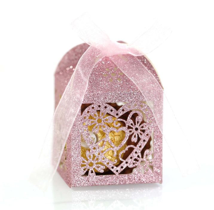 Pink glittery box with a heart design on a white background