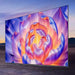 Large TV screen displaying a colorful abstract flower design with a scenic background.