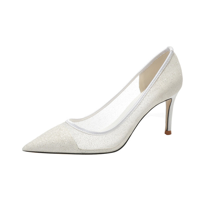 White high-heeled shoe on a white background