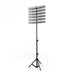 Black music stand with multiple shelves on a white background