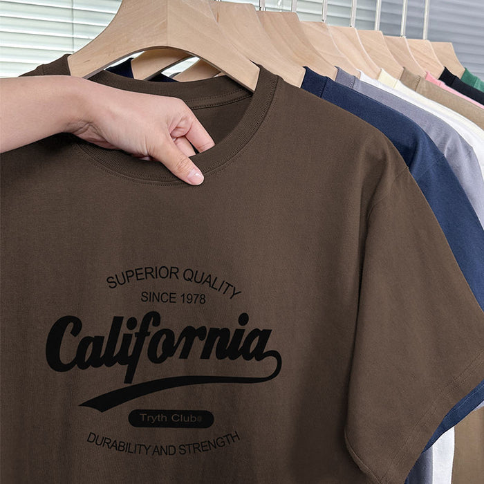 Brown t-shirt with 'California' text on a hanger with other shirts in the background