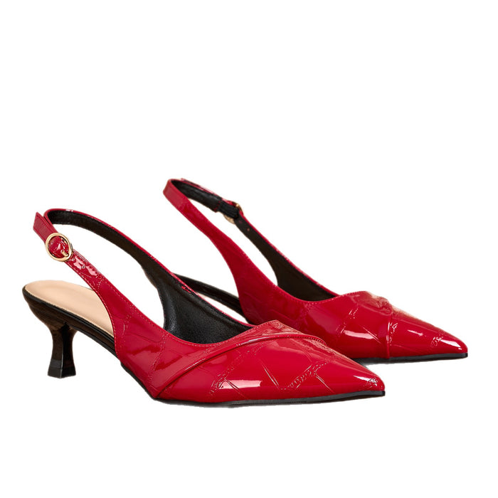 A pair of red patent leather slingback pumps with a pointed toe and a low kitten heel, shown against a plain white background.