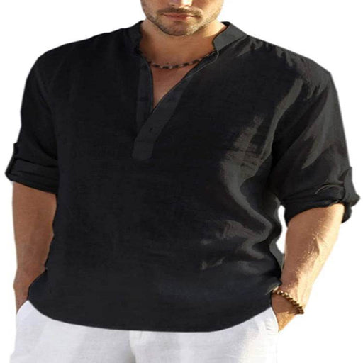 Man wearing a black shirt with rolled-up sleeves on a white background