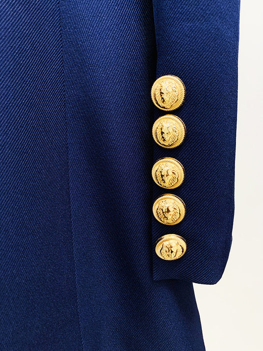 Close-up of a navy blue jacket with gold buttons on a white background