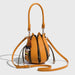 Orange handbag with a strap on a light gray background