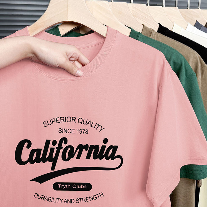 Pink t-shirt with 'California' text on a hanger with other shirts.