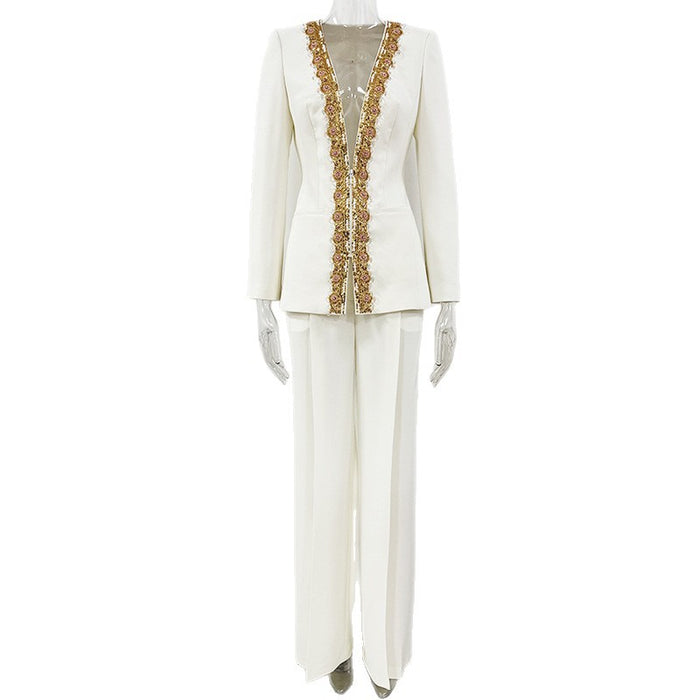 White suit with gold embellishments on a white background