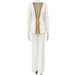 White suit with gold embellishments on a white background