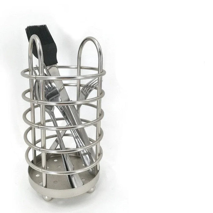 Stainless steel utensil holder with chopsticks and a brush on a white background