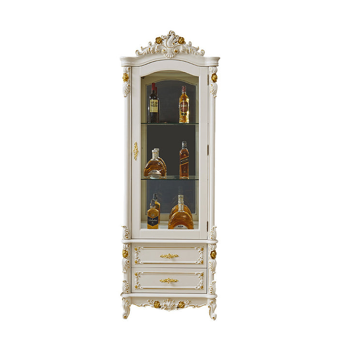 Decorative white cabinet with gold accents displaying bottles on a white background