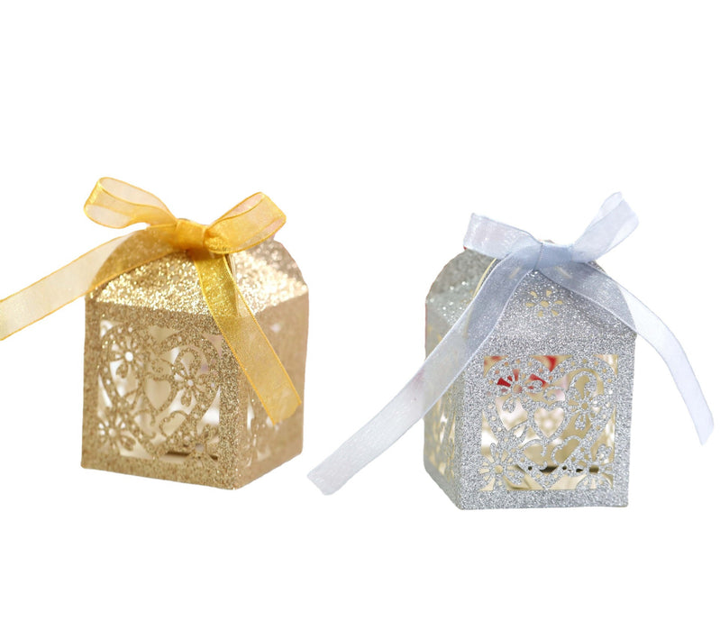Two decorative boxes with ribbons on a white background