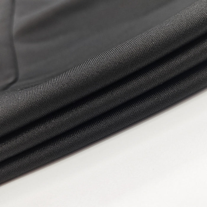 Close-up of black fabric on a white background
