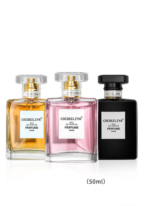 Three perfume bottles with different colored caps on a white background