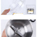 Stainless steel food processor with transparent lid and visible interior components.