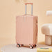 Pink suitcase on a beige background