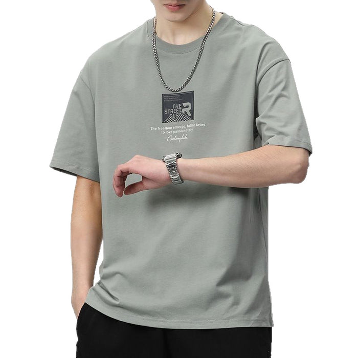 Person wearing a gray t-shirt with a logo and text on a white background