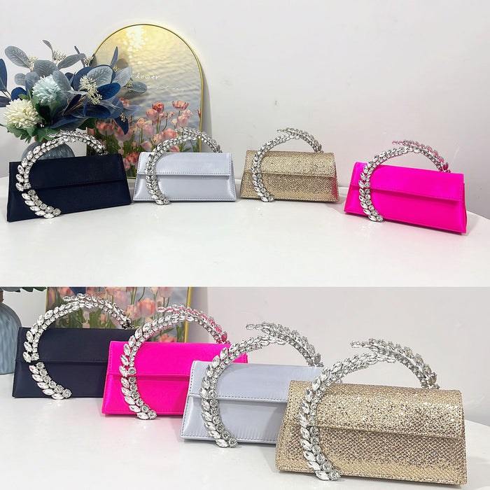 Collection of handbags with decorative handles on a white surface.