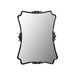 Decorative mirror with ornate black frame on a white background