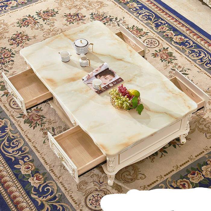 Decorative coffee table with marble-like surface on a patterned rug