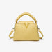 Yellow handbag with a gold handle and clasp on a white background