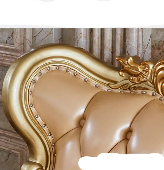 Gold and beige decorative headboard with intricate details on a marble wall background