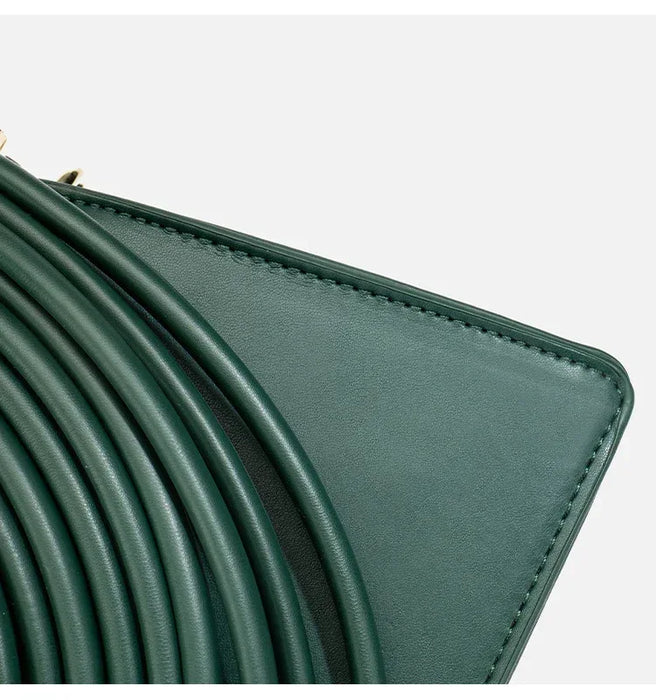 Close-up of a green leather wallet with a white background