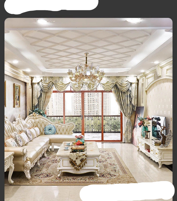 Luxurious living room with elegant decor and a chandelier.