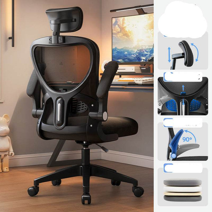Black office chair in a room with a computer setup, featuring adjustable features on the right.