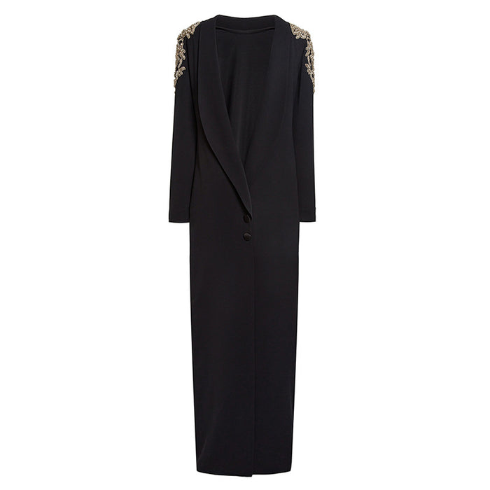 Black dress with floral embellishments on shoulders against a white background