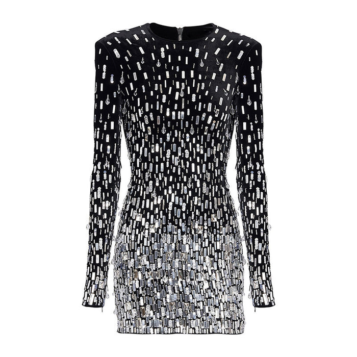 Black dress with silver sequin pattern on a white background