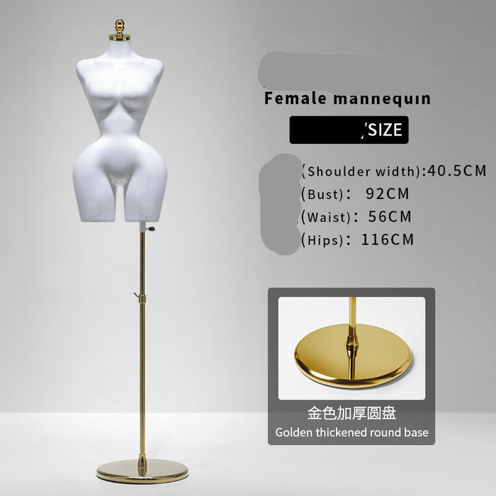 White female mannequin on a gold stand with size information displayed.