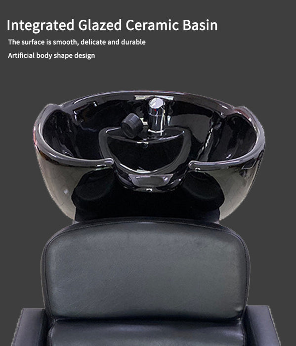Black ceramic basin with a gray chair on a dark background