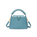 Blue handbag with gold accents on a white background