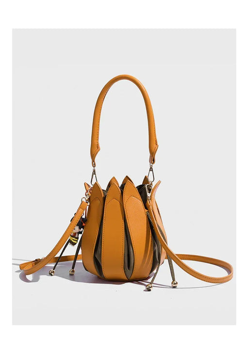 Yellow handbag with a unique design on a white background