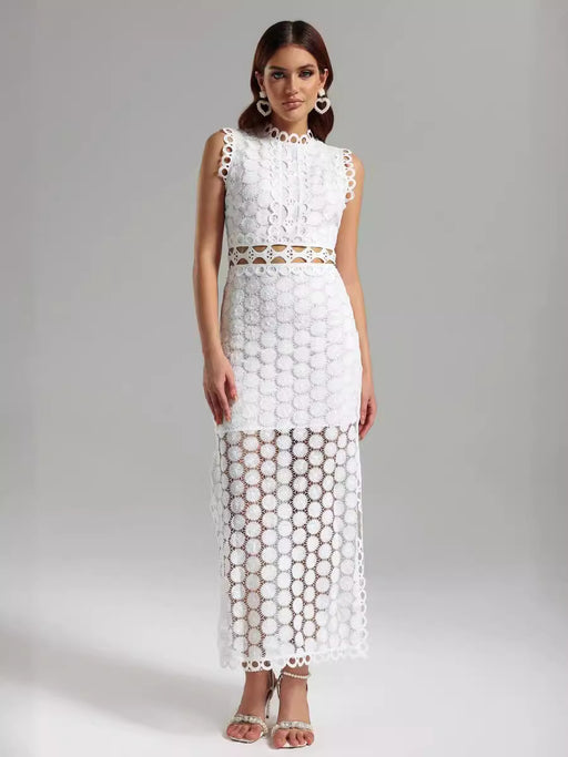 Woman wearing a white lace dress on a gray background