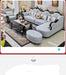 Luxury living room setup with gray sofa, coffee table, and decorative items.