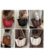 A 6-panel collage showing a women's structured bucket tote bag in multiple colors, worn by models in different outfits. The bag features a curved, tiered silhouette with vertical contrast stitching and top handles.