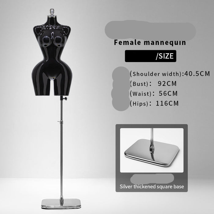 Black female mannequin with size information on a gray background