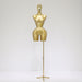 Gold mannequin on a stand against a white background