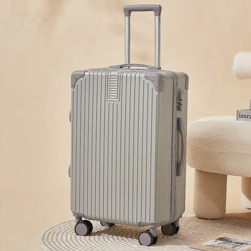 Silver suitcase with wheels on a beige background
