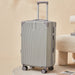 Silver suitcase with wheels on a beige background